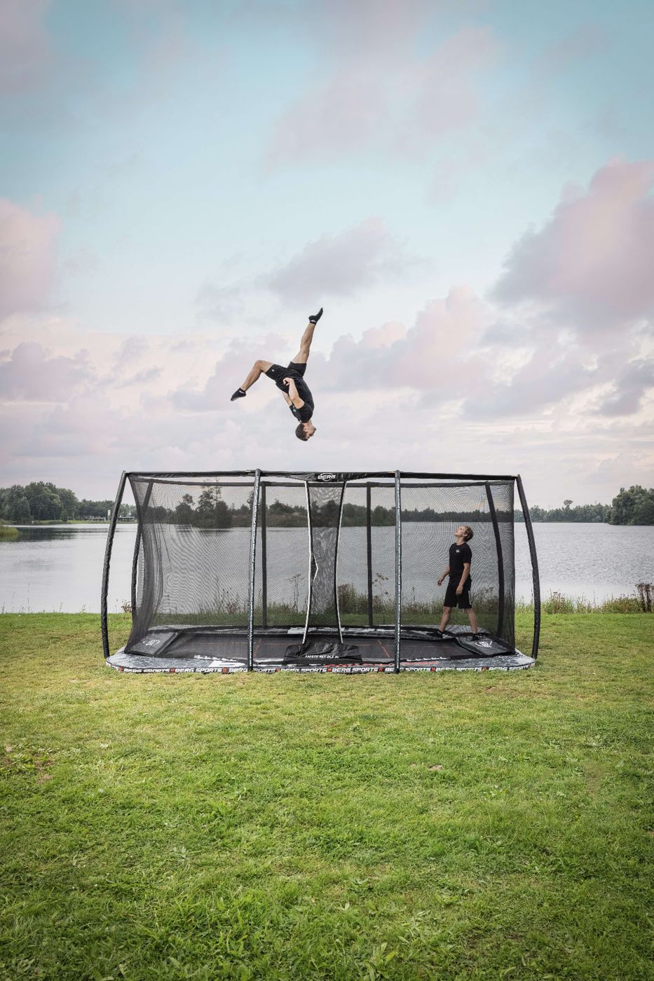 BERG FlatGround trampoline set level with the lawn in a garden
